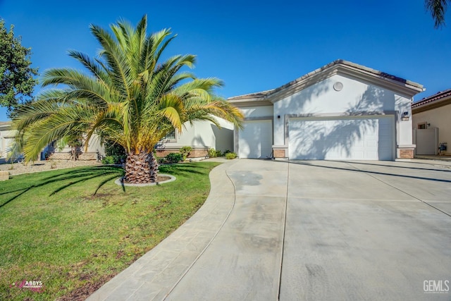 view of front of property with a garage and a front yard