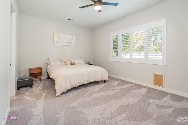 bedroom with ceiling fan and light colored carpet