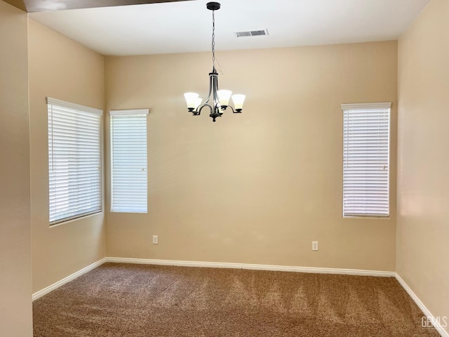 11016 Snowcreek Falls Ave, Bakersfield, CA 93312 - carpeted empty room featuring a chandelier and baseboards