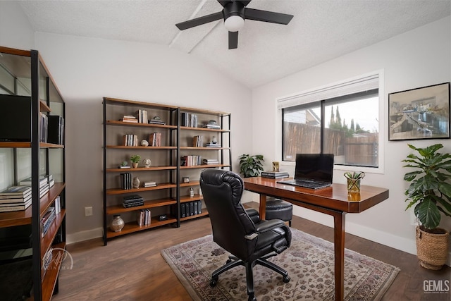 office space with ceiling fan, lofted ceiling, dark hardwood / wood-style floors, and a textured ceiling