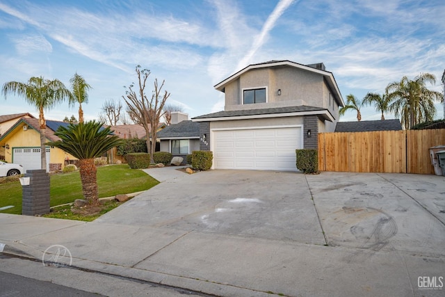 front facade featuring a garage and a front lawn