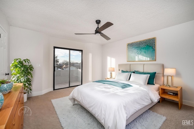 carpeted bedroom with ceiling fan, access to outside, and a textured ceiling