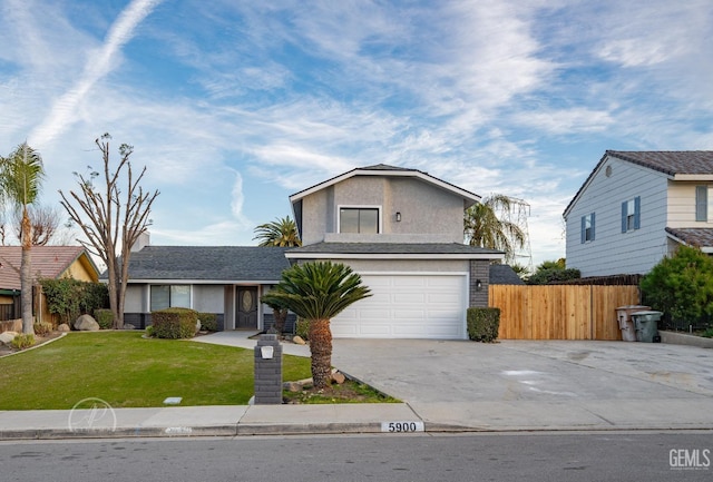 view of front property with a garage and a front lawn