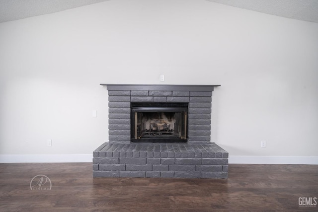 room details with wood-type flooring, a fireplace, and a textured ceiling