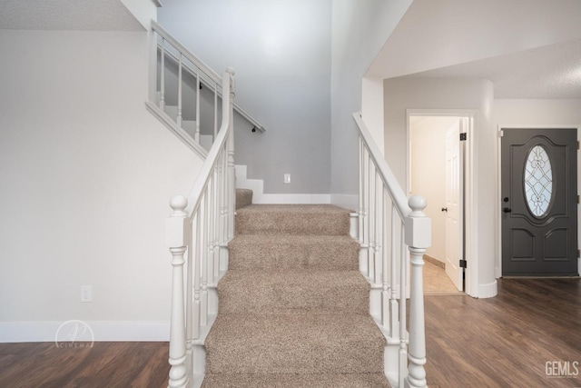 entrance foyer featuring dark hardwood / wood-style floors