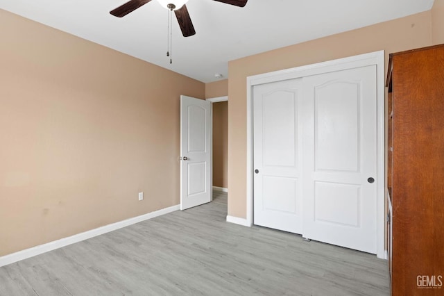 3406 Kimmie Rachelle Ct, Bakersfield, CA 93313 - unfurnished bedroom featuring wood finished floors, a closet, baseboards, and a ceiling fan