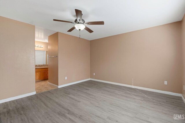 3406 Kimmie Rachelle Ct, Bakersfield, CA 93313 - empty room featuring ceiling fan, light wood-type flooring, and baseboards