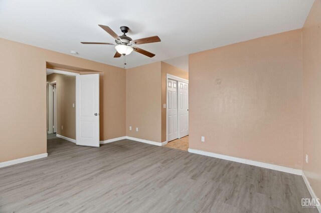 3406 Kimmie Rachelle Ct, Bakersfield, CA 93313 - spare room with ceiling fan, light wood-style flooring, and baseboards
