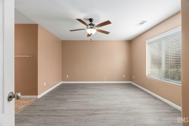 3406 Kimmie Rachelle Ct, Bakersfield, CA 93313 - unfurnished room featuring ceiling fan, baseboards, and wood finished floors