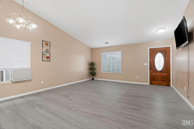 3406 Kimmie Rachelle Ct, Bakersfield, CA 93313 - entrance foyer with a chandelier, wood finished floors, lofted ceiling, and baseboards