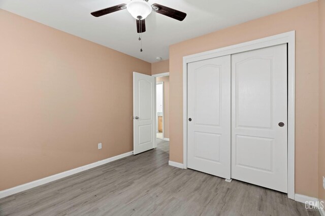 3406 Kimmie Rachelle Ct, Bakersfield, CA 93313 - unfurnished bedroom featuring light wood-style floors, baseboards, a closet, and ceiling fan
