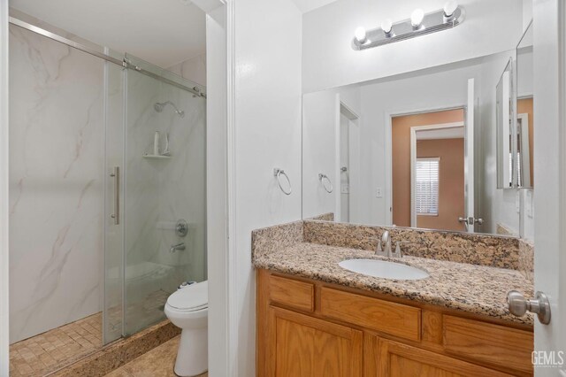 3406 Kimmie Rachelle Ct, Bakersfield, CA 93313 - full bath with a marble finish shower, vanity, toilet, and tile patterned floors