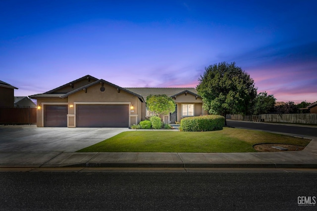 9803 Swansboro Way, Bakersfield, CA 93314 - view of front of house with an attached garage, stucco siding, and driveway