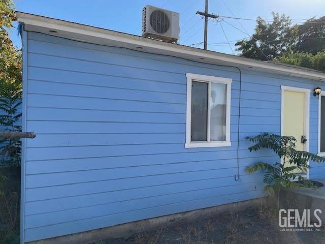 view of property exterior featuring central air condition unit and ac unit