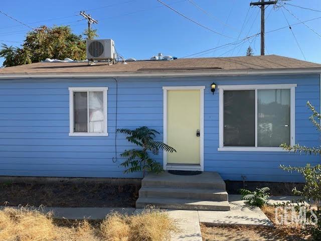 view of front of property featuring cooling unit