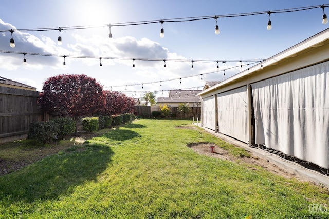 view of yard with a fenced backyard