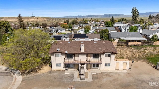 drone / aerial view featuring a mountain view and a residential view