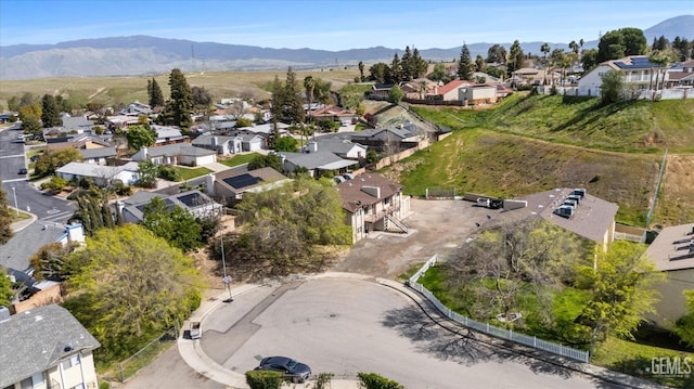 birds eye view of property featuring a mountain view and a residential view