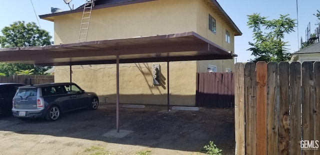 view of vehicle parking with a carport