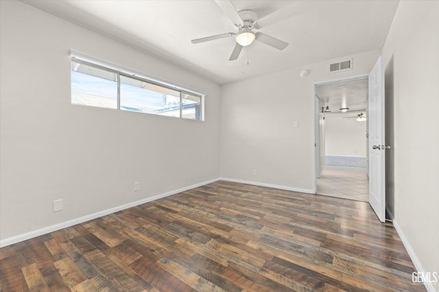 unfurnished room featuring ceiling fan and dark hardwood / wood-style flooring