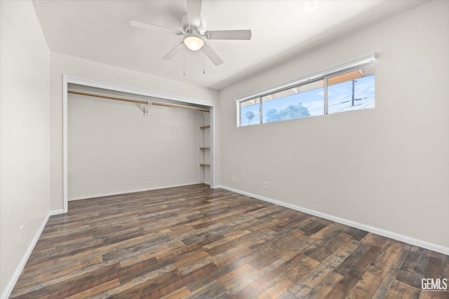 unfurnished bedroom with a closet, ceiling fan, and dark hardwood / wood-style floors