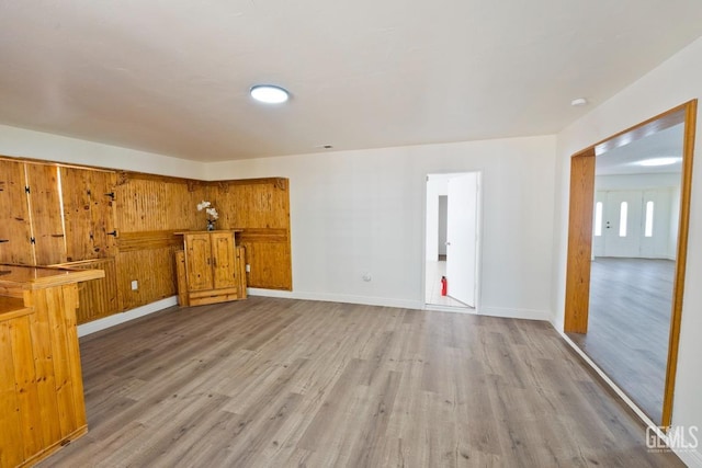 unfurnished living room with hardwood / wood-style floors