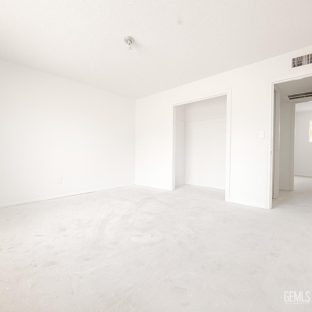 3804 University Ave, Bakersfield, CA 93306 - unfurnished bedroom with light carpet, a closet, and a textured ceiling