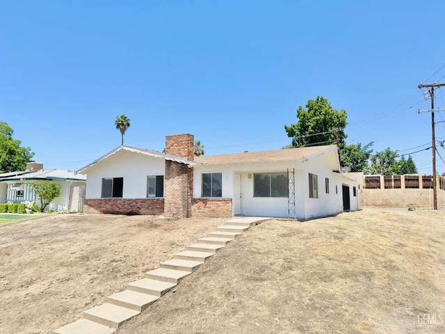 3804 University Ave, Bakersfield, CA 93306 - ranch-style house featuring a chimney, brick siding, and stucco siding