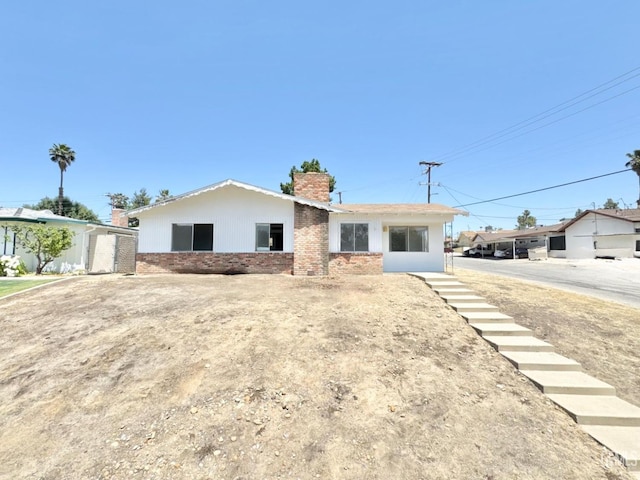 3804 University Ave, Bakersfield, CA 93306 - ranch-style house featuring a chimney and brick siding