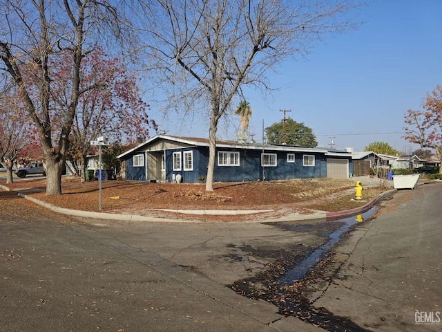 single story home with an attached garage and driveway