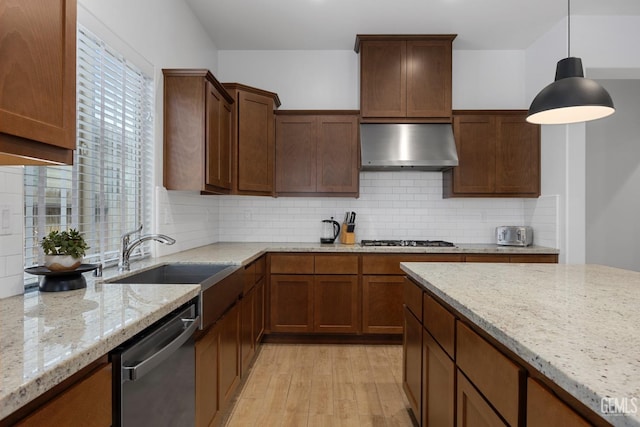 9003 Del Palma Dr, Bakersfield, CA 93314 - kitchen featuring range hood, appliances with stainless steel finishes, light wood-style flooring, tasteful backsplash, and light stone counters