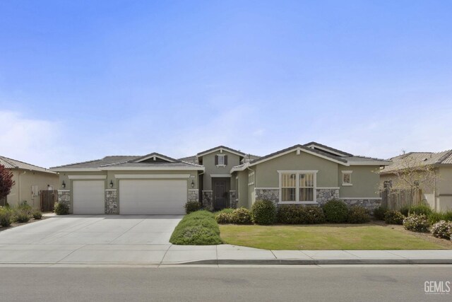 9003 Del Palma Dr, Bakersfield, CA 93314 - view of front of house with stone siding, a garage, stucco siding, and a front yard