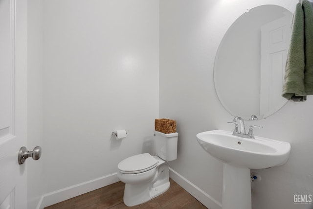 9003 Del Palma Dr, Bakersfield, CA 93314 - bathroom with wood finished floors and toilet