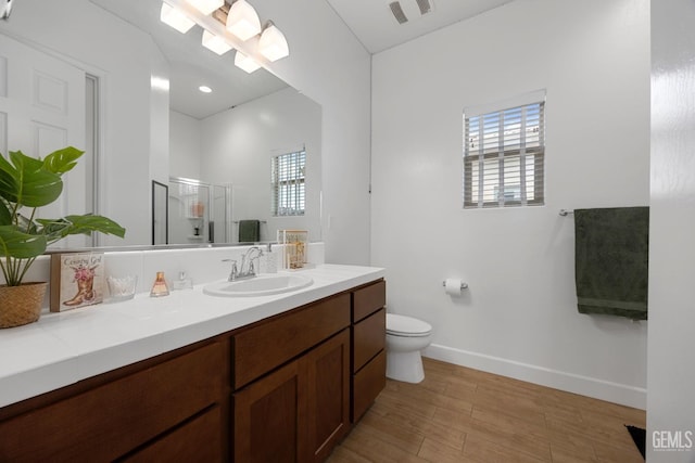 9003 Del Palma Dr, Bakersfield, CA 93314 - bathroom featuring vanity, wood finished floors, and a stall shower