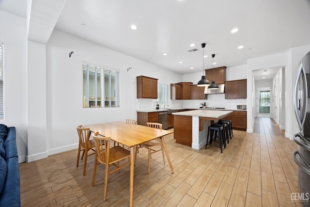 9003 Del Palma Dr, Bakersfield, CA 93314 - dining area featuring light wood finished floors and recessed lighting