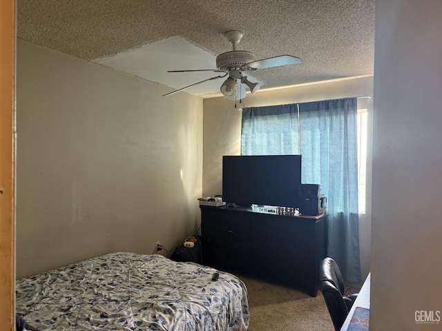 carpeted bedroom featuring multiple windows, ceiling fan, and a textured ceiling