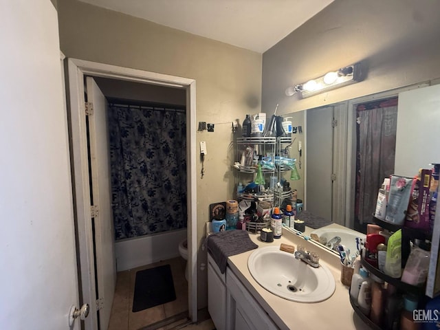 full bathroom with vanity, shower / bath combo, tile patterned floors, and toilet