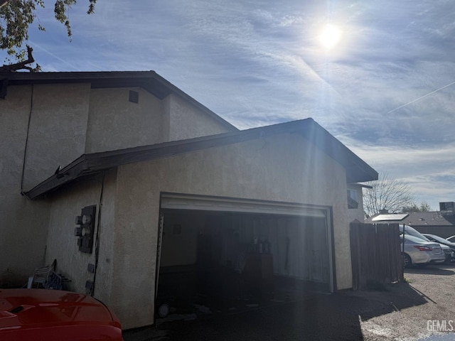 view of side of home with a garage