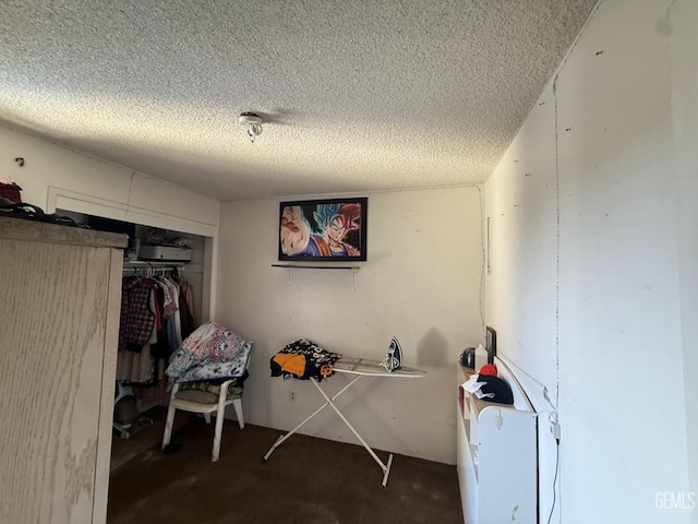 bedroom with a closet and a textured ceiling