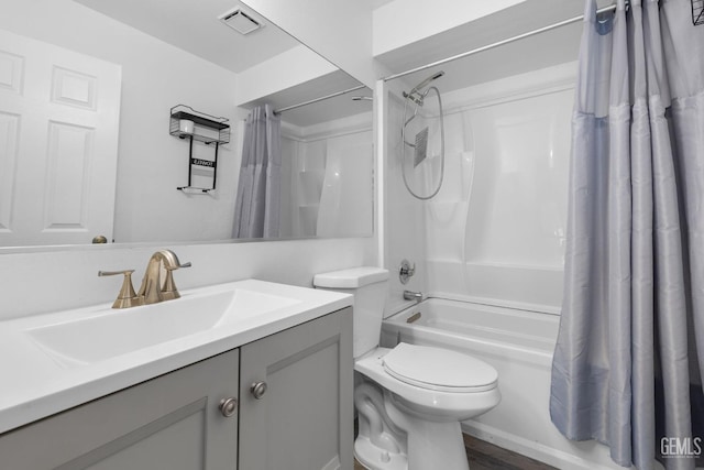 full bath featuring visible vents, vanity, toilet, and shower / tub combo with curtain