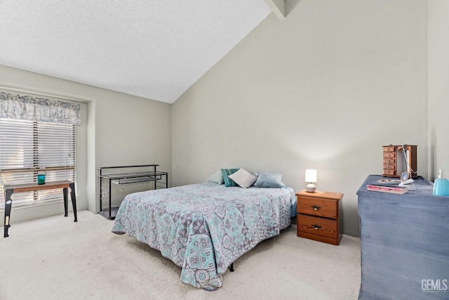 bedroom featuring vaulted ceiling, a textured ceiling, and carpet