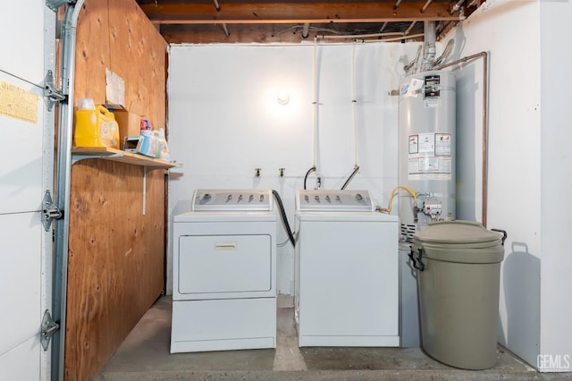 clothes washing area with independent washer and dryer and gas water heater