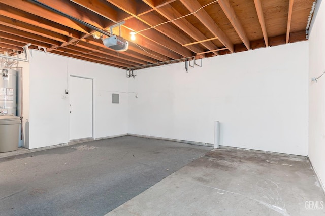 garage with a garage door opener and water heater