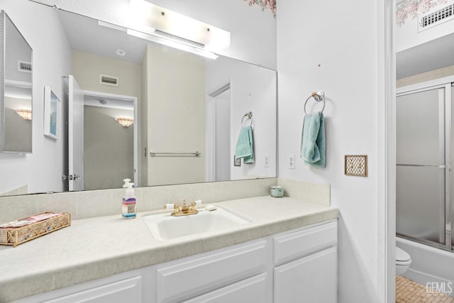 full bath featuring visible vents, vanity, and toilet