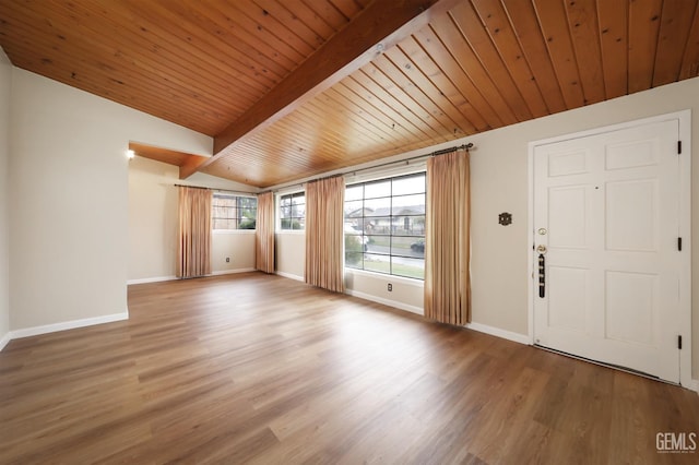 foyer with wooden ceiling, lofted ceiling with beams, baseboards, and wood finished floors