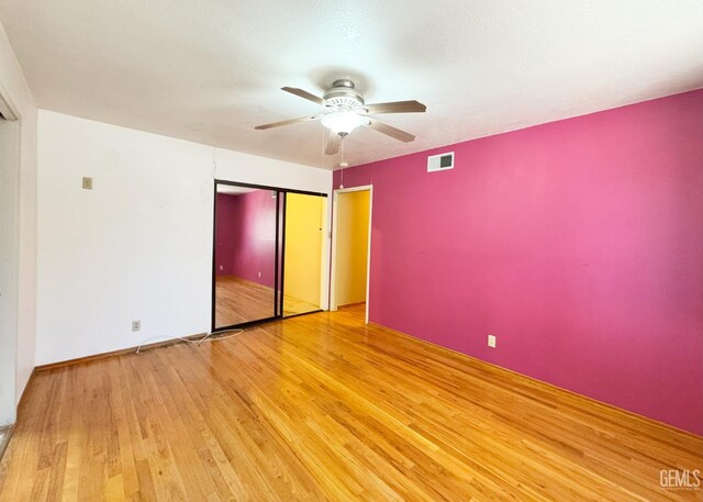 1041 Golden Gate Ave, Dos Palos, CA 93620 - unfurnished bedroom with wood finished floors and a ceiling fan