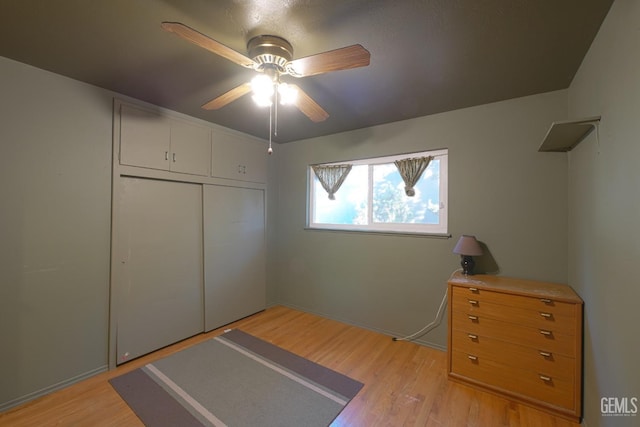 1041 Golden Gate Ave, Dos Palos, CA 93620 - bedroom featuring ceiling fan, a closet, and light wood-type flooring