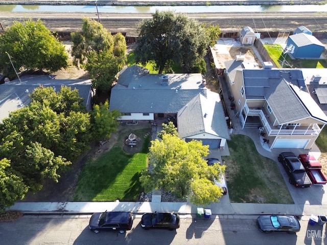 1041 Golden Gate Ave, Dos Palos, CA 93620 - aerial perspective of suburban area featuring a nearby body of water