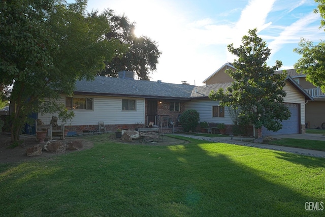 1041 Golden Gate Ave, Dos Palos, CA 93620 - view of front of home with an attached garage, a front lawn, and a chimney