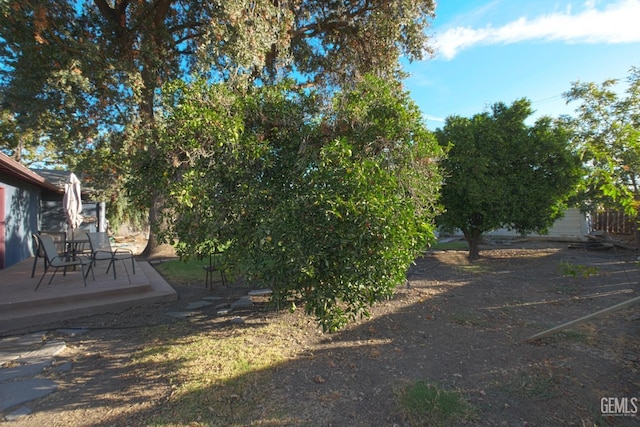 1041 Golden Gate Ave, Dos Palos, CA 93620 - view of yard with a wooden deck